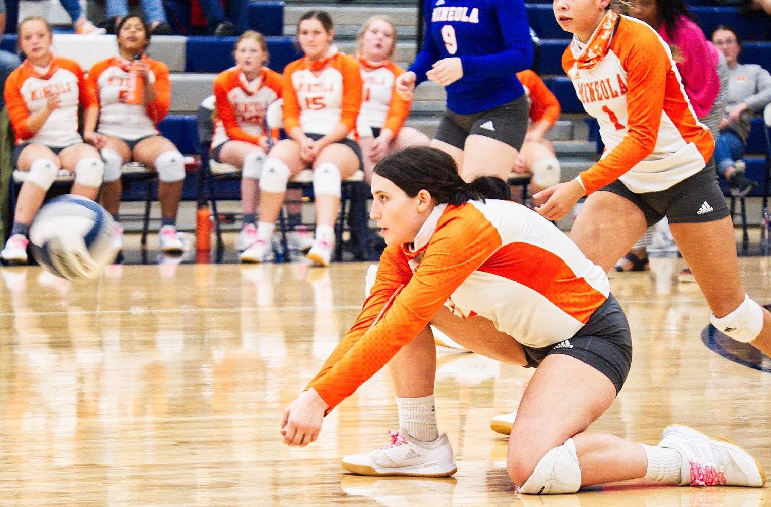 Mineola standout Brittany Pickle kneels for the dig.
